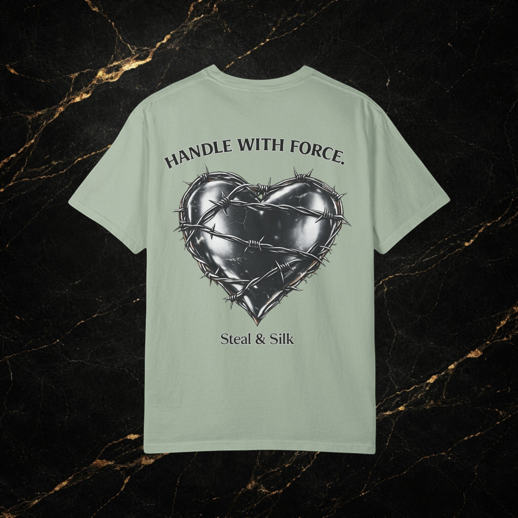 Steal & Silk light green cotton t-shirt with a black barbed wire heart graphic and "Handle With Force" text.