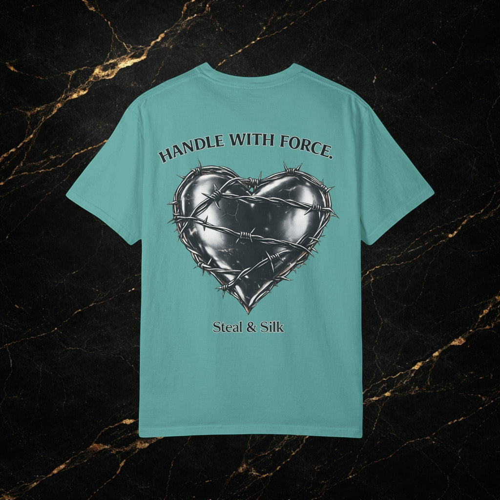 Steal & Silk teal cotton t-shirt with a barbed wire heart graphic and "Handle With Force" text.
