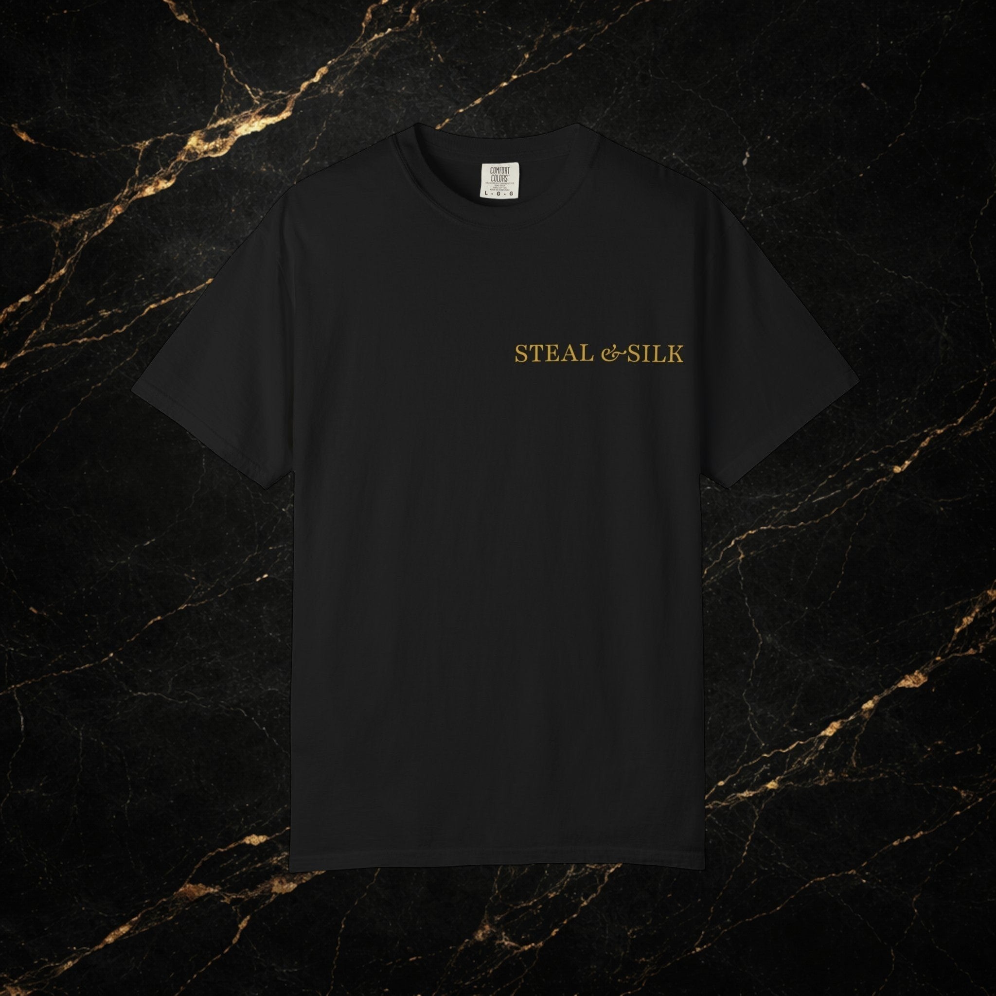 Steal & Silk black cotton t-shirt with gold "Handle With Force" heart graphic on the chest.