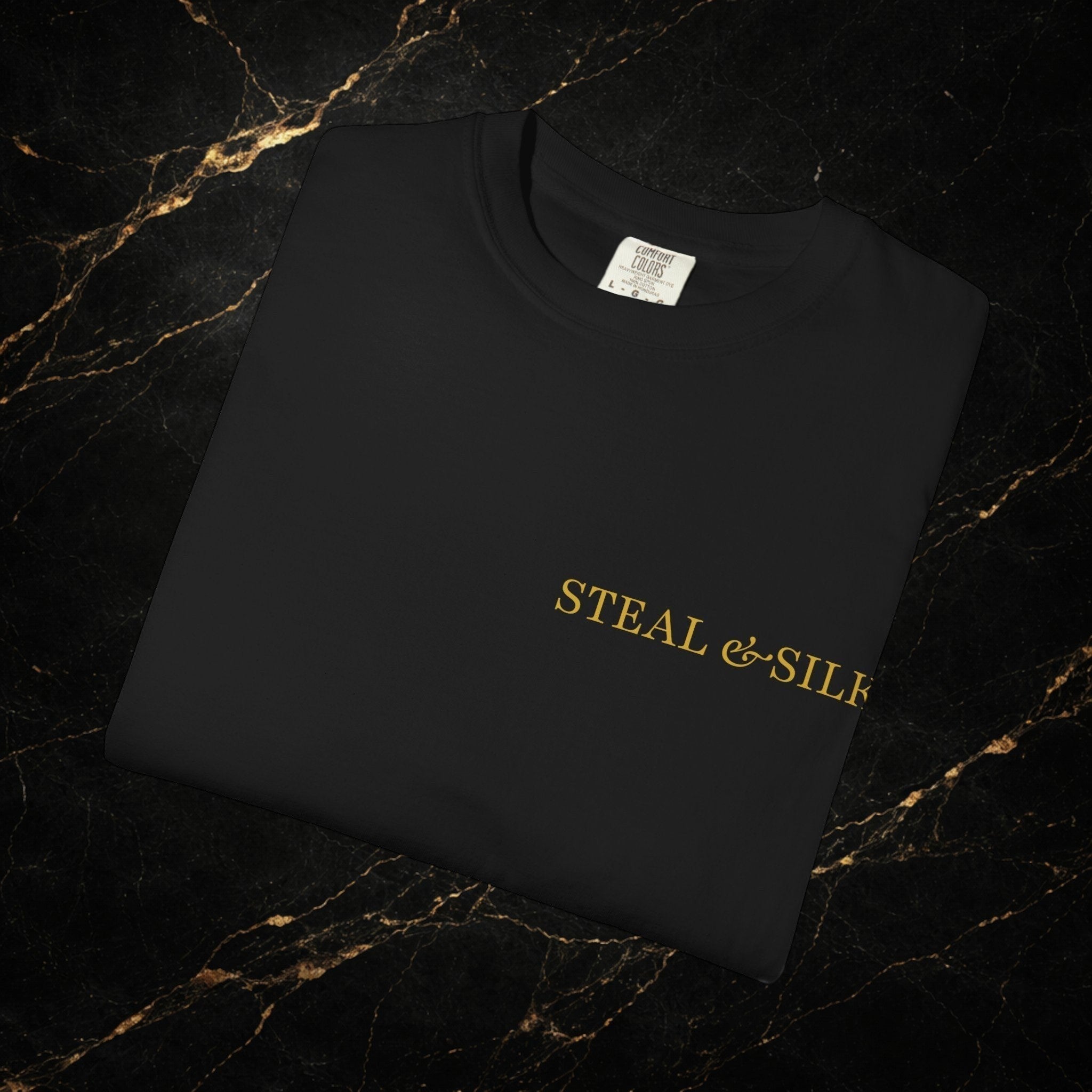 Steal & Silk black cotton t-shirt with gold "Handle With Force" heart graphic on chest.