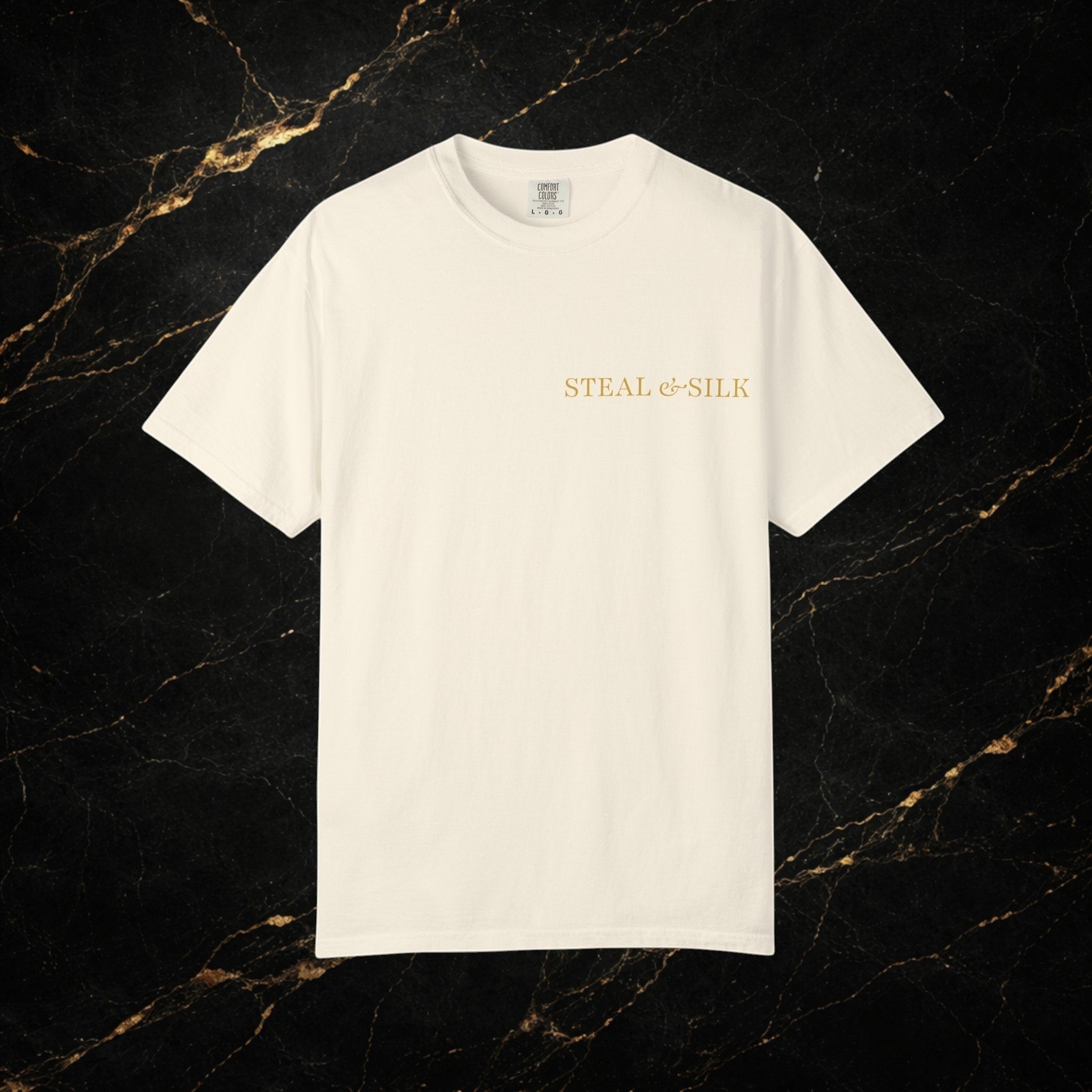 Steal & Silk cream cotton t-shirt with gold 'Handle With Force' heart graphic on chest.