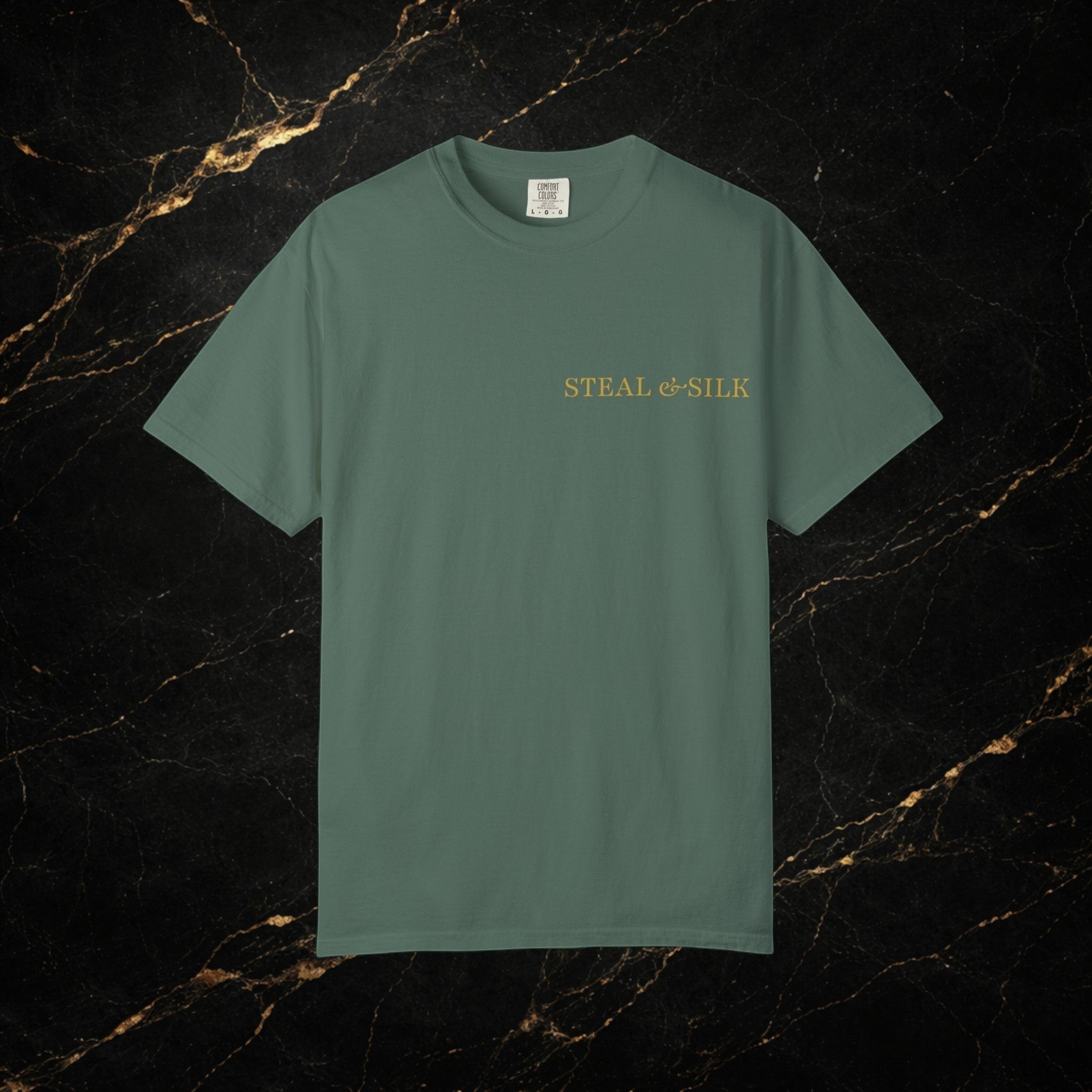 Steal & Silk green cotton t-shirt with gold "Handle With Force" heart graphic on chest.