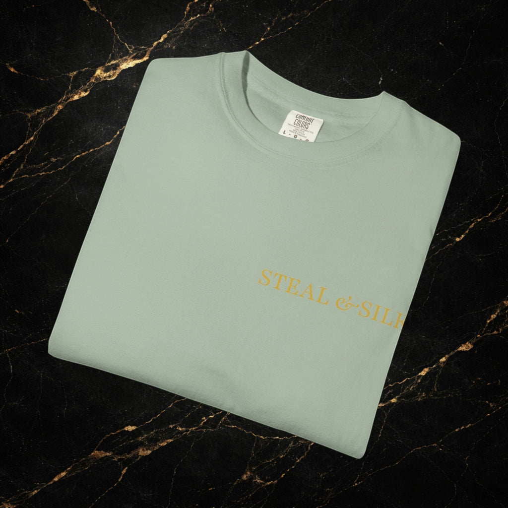 Steal & Silk pale green cotton t-shirt with "Handle With Force" heart graphic and brand logo.