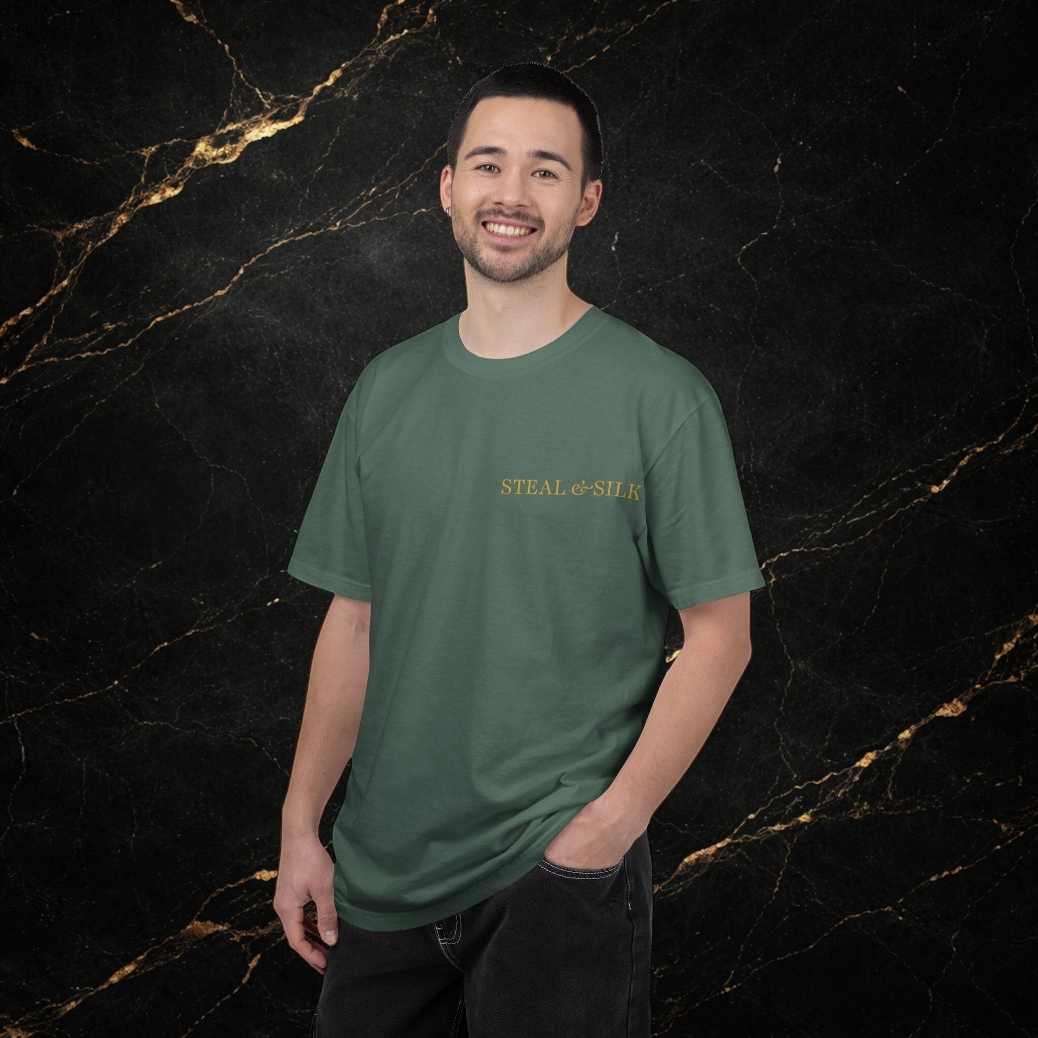 Steal & Silk green cotton t-shirt with "Handle With Force" heart graphic on the front.
