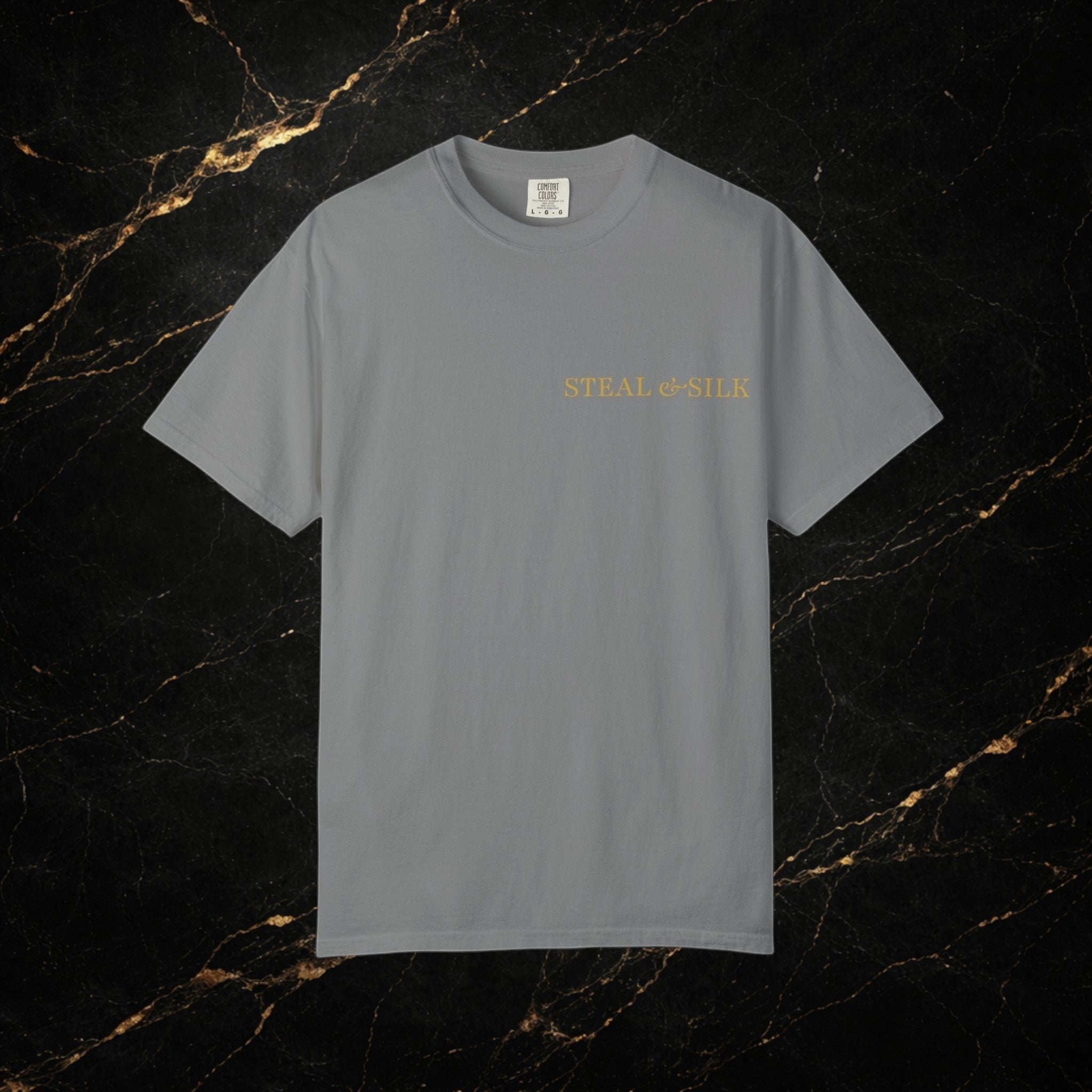 Steal & Silk grey cotton t-shirt with gold 'Handle With Force' heart graphic on chest.
