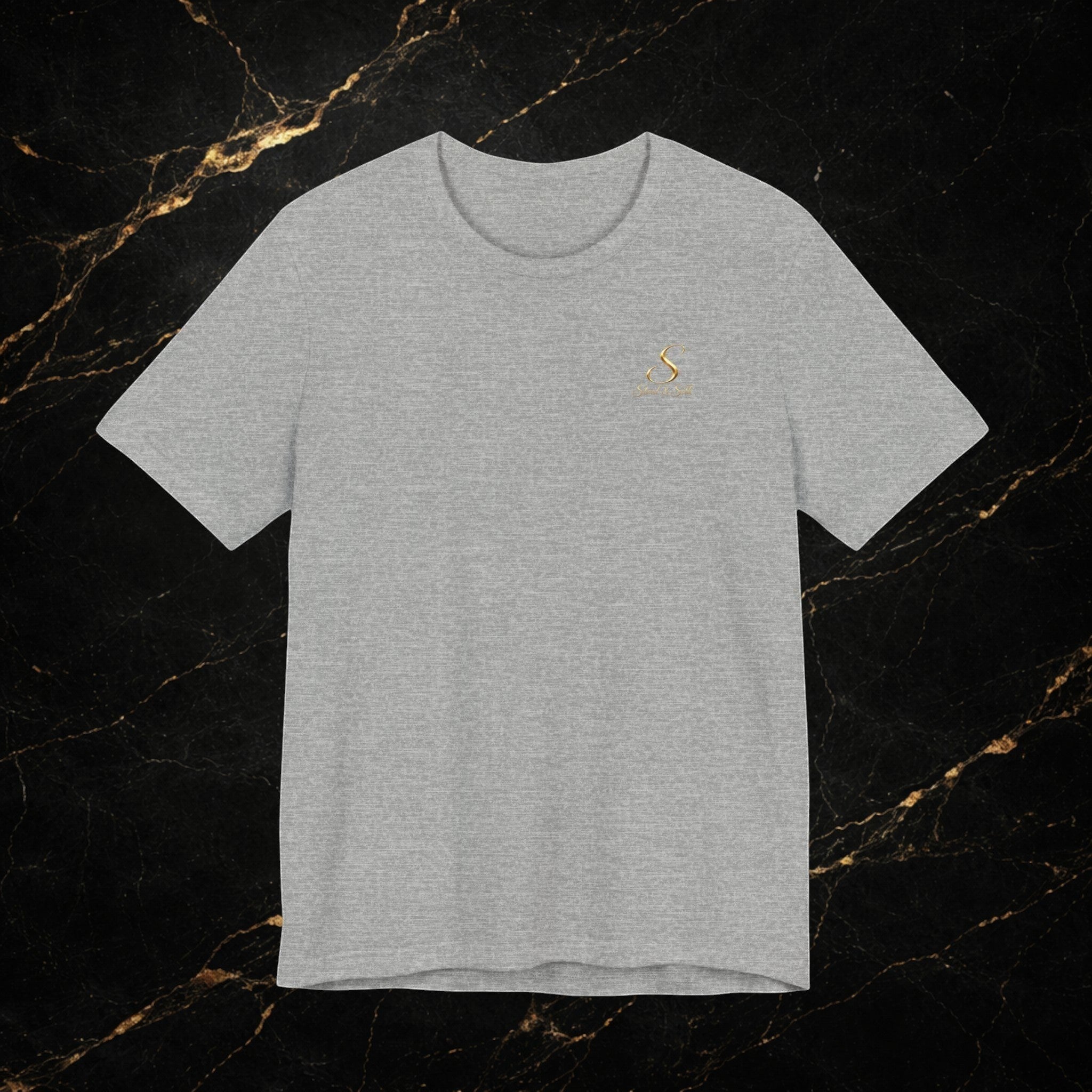 Steal & Silk grey cotton t-shirt with a small gold logo on the chest and a large retro graphic on the back.