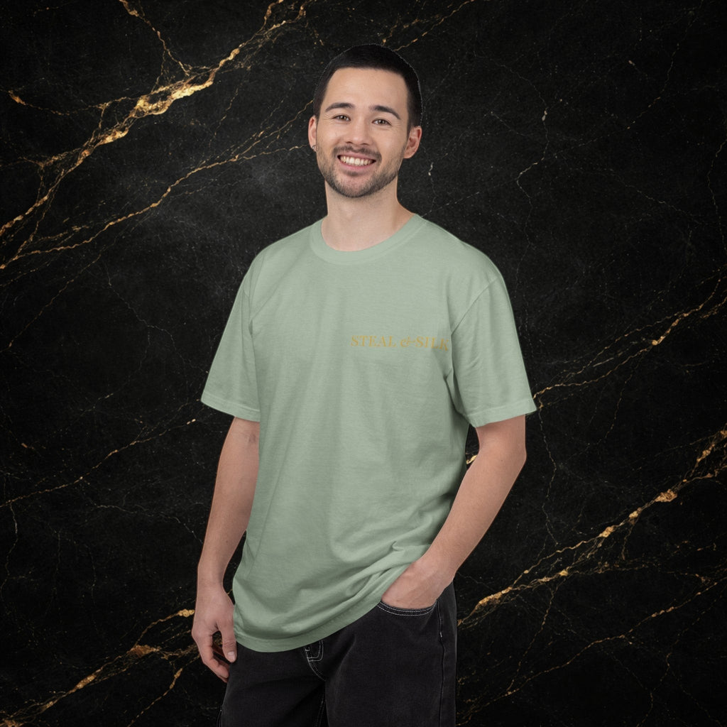 Steal & Silk light sage green cotton t-shirt with subtle gold "Handle With Force" heart graphic on chest.