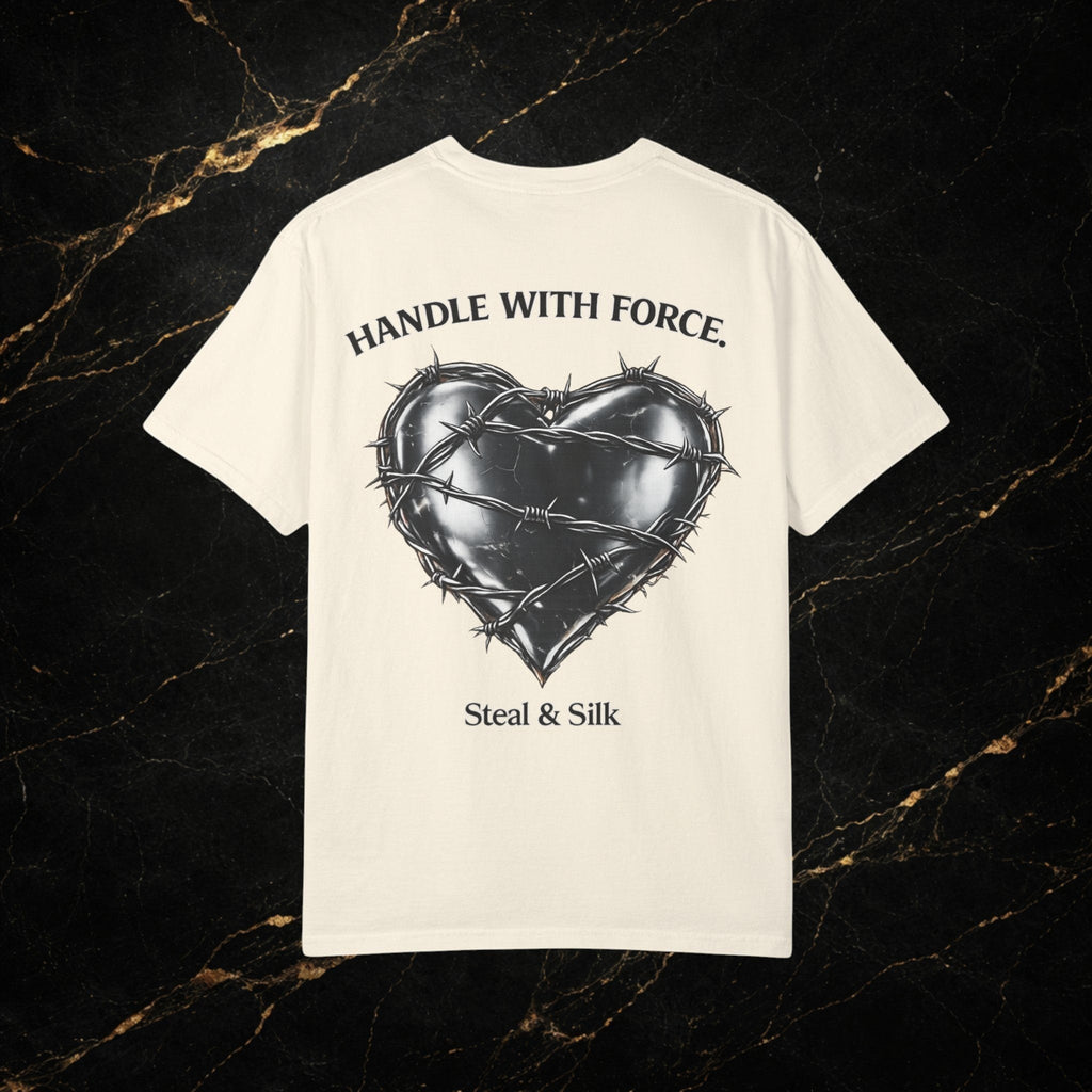Steal & Silk cream cotton t-shirt with barbed wire heart graphic and "Handle With Force" text.