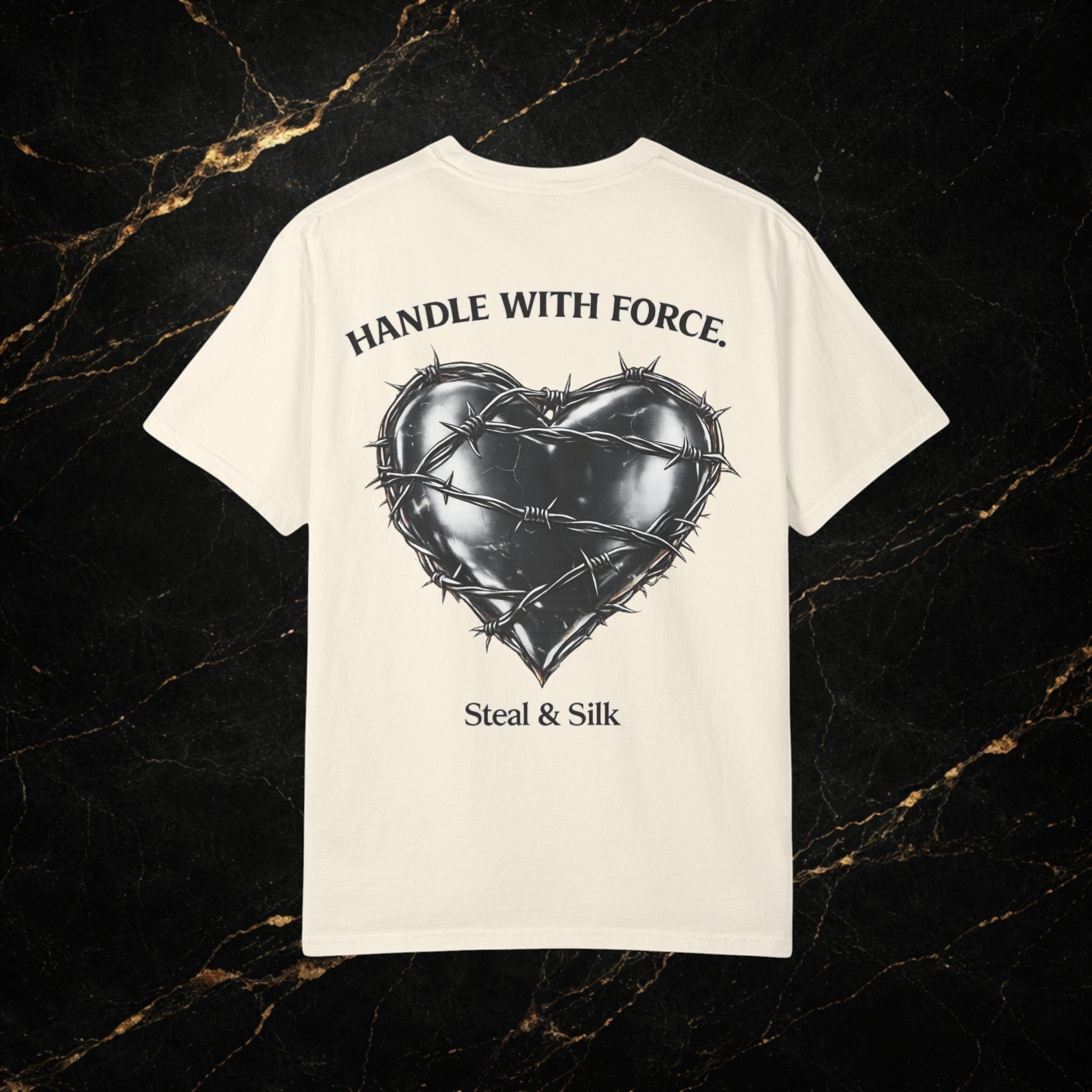 Steal & Silk cream cotton t-shirt with barbed wire heart graphic and "Handle With Force" text.