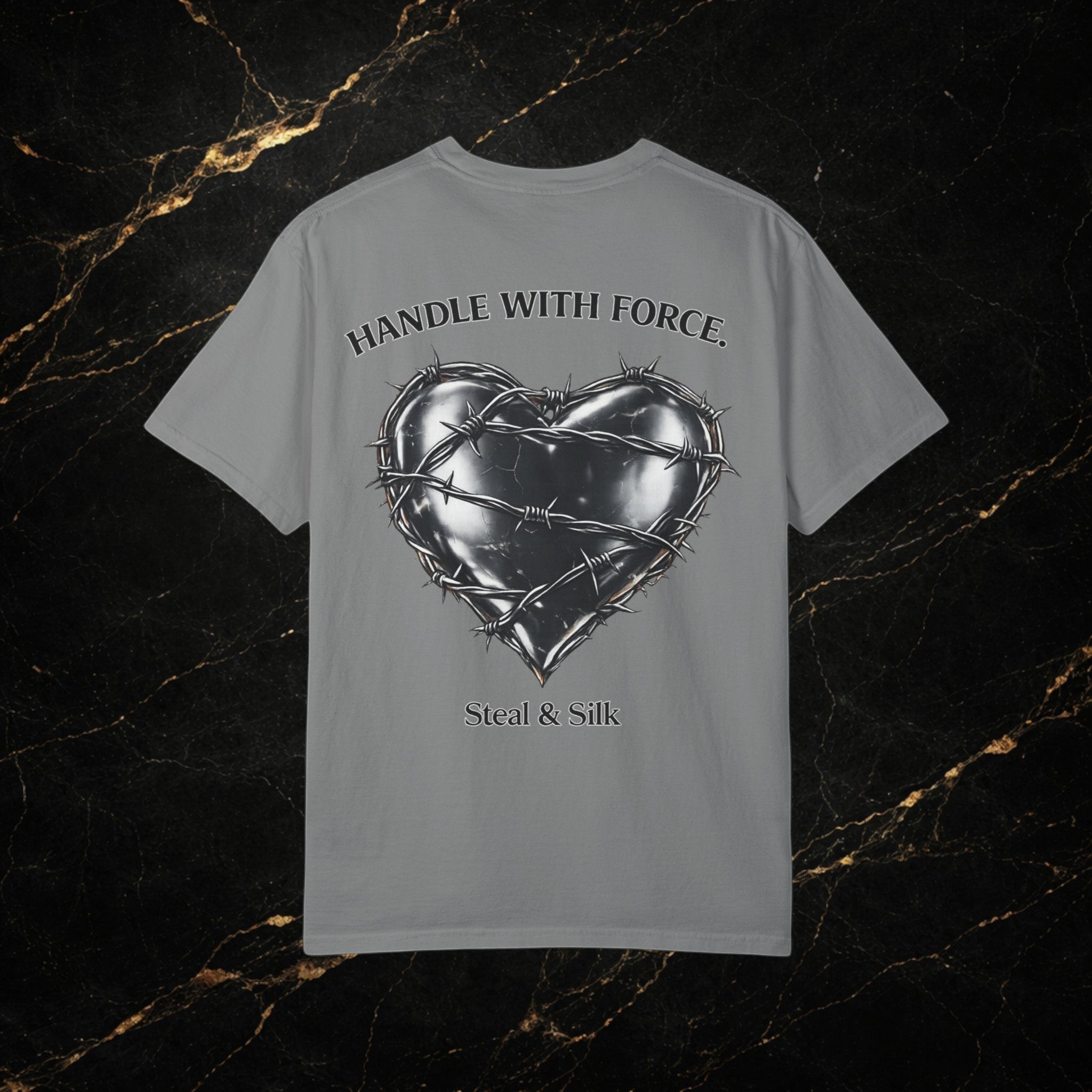 Steal & Silk grey cotton t-shirt with a barbed wire heart graphic and "Handle With Force" text.