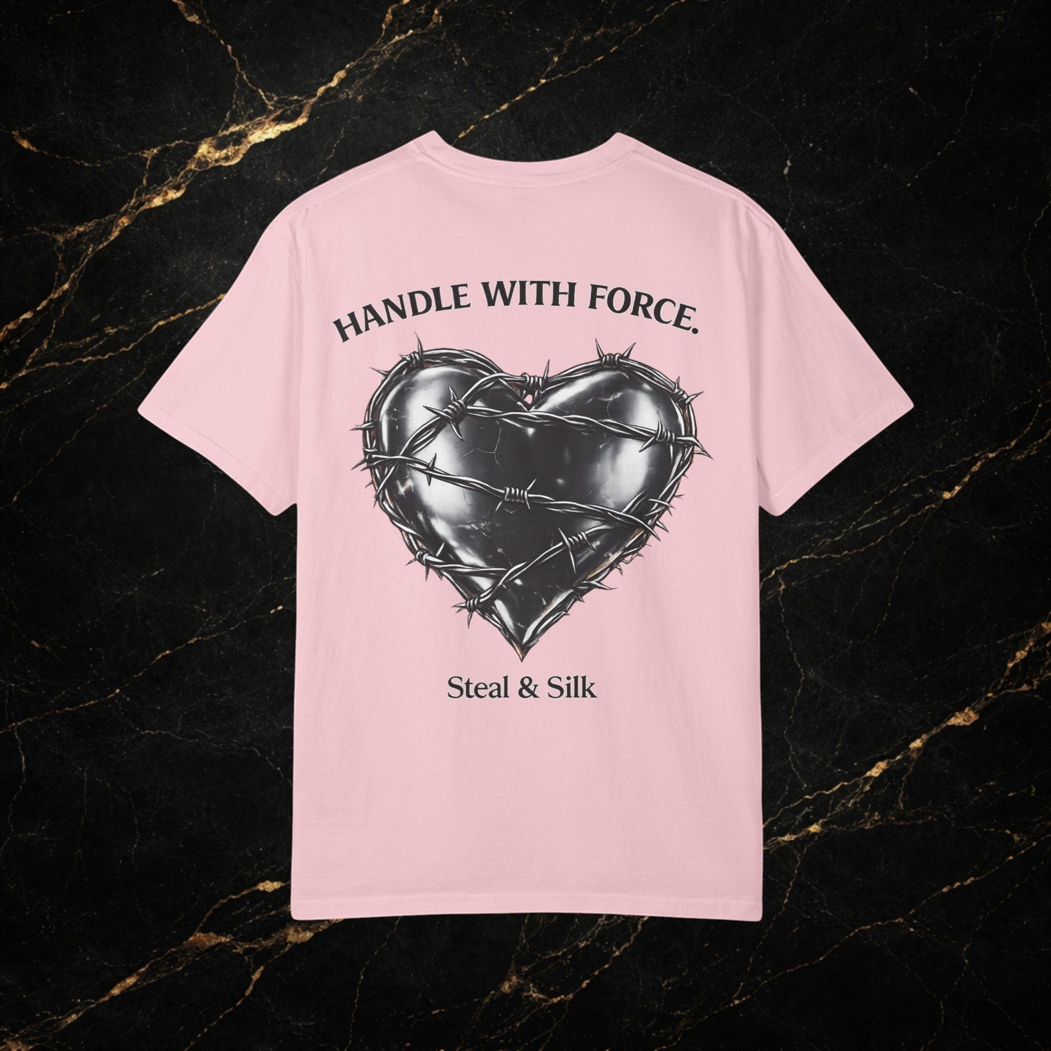 Steal & Silk pink cotton t-shirt with a black barbed wire heart graphic and "Handle With Force" text.