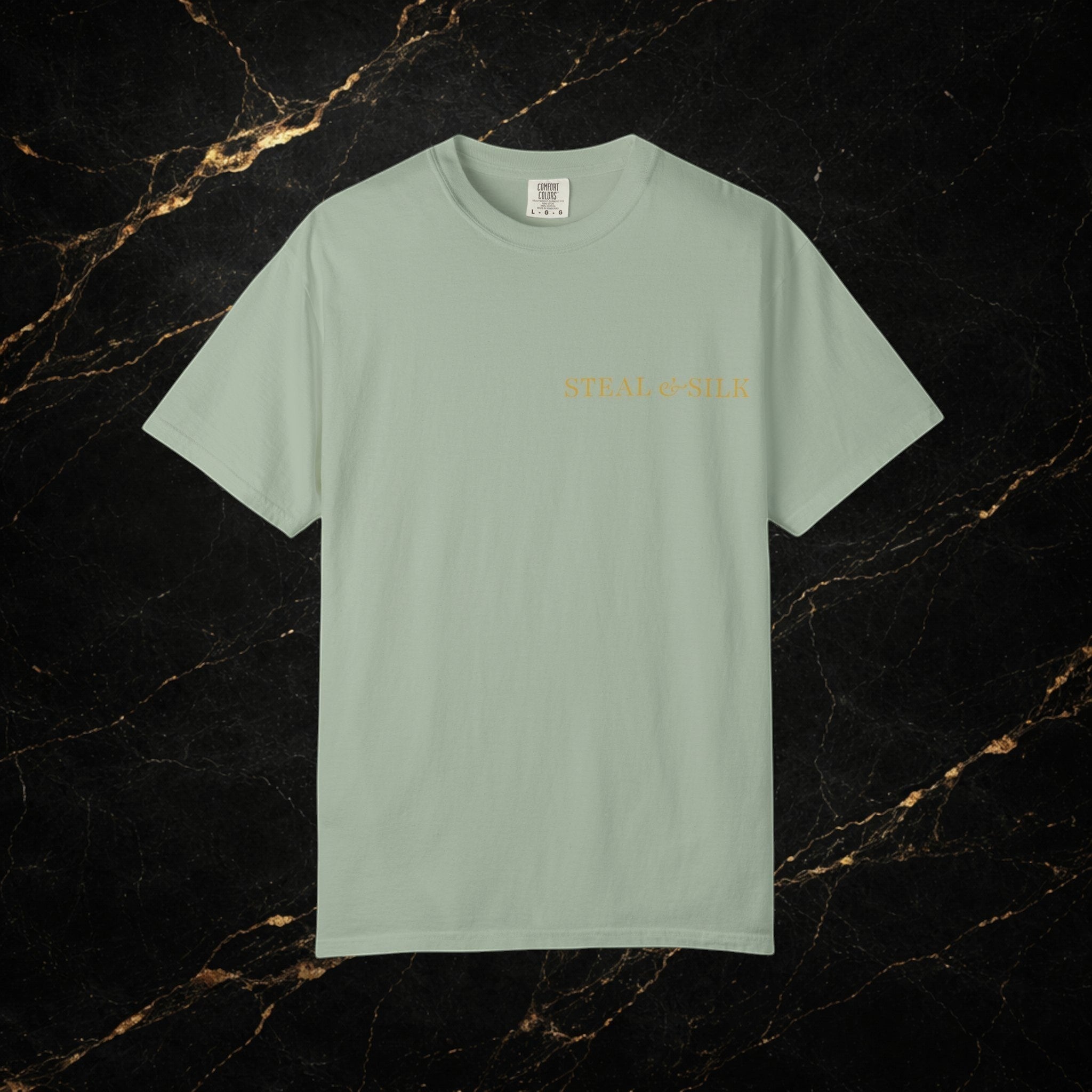 Steal & Silk light sage green cotton t-shirt with "Handle With Force" heart graphic on chest.