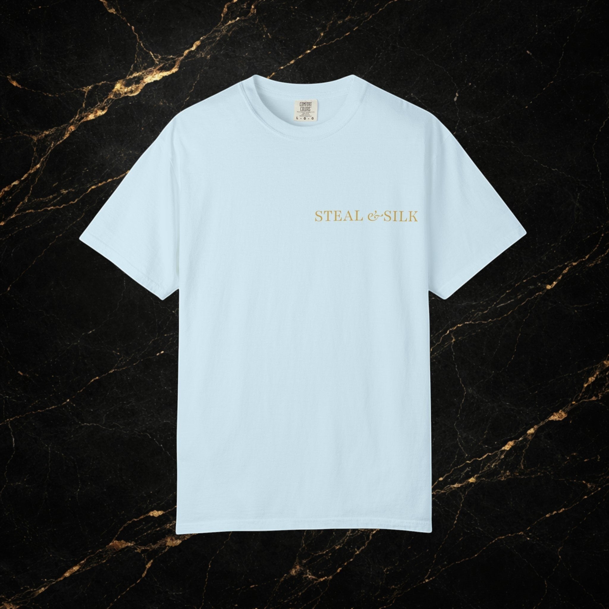 Steal & Silk light blue cotton t-shirt with gold "Handle With Force" heart graphic on chest.