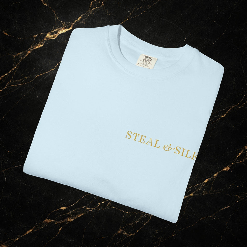 Steal & Silk light blue cotton t-shirt with gold "Handle With Force" heart graphic on chest.