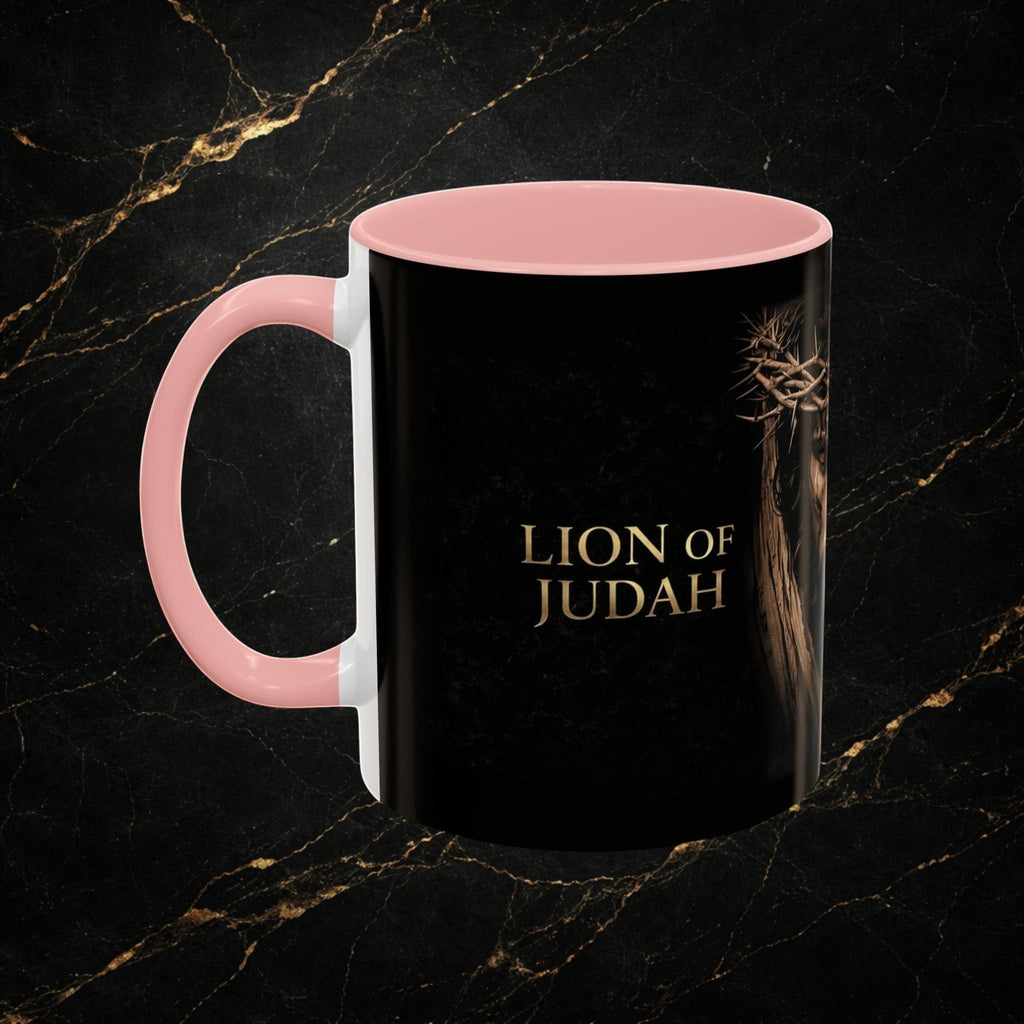 Steal & Silk black ceramic mug with pink handle, featuring the Lion of Judah and crown of thorns design.