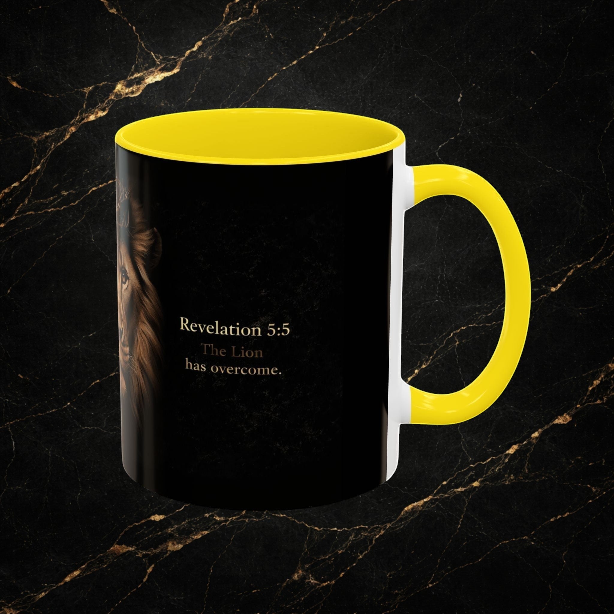 Steal & Silk black ceramic mug with yellow handle and interior, featuring a Lion of Judah graphic and "Revelation 5:5 The Lion has overcome."