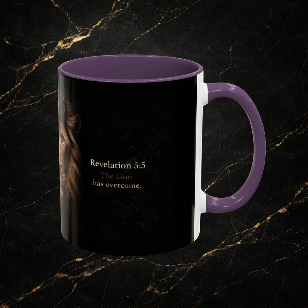 Steal & Silk Lion of Judah Overcomer ceramic mug with purple handle and interior, featuring a lion's face and Bible verse.