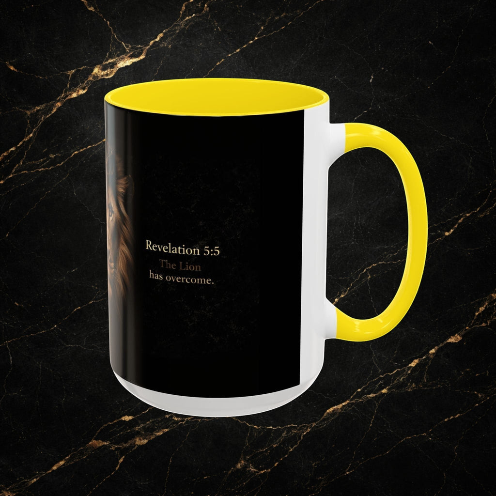 Steal & Silk white ceramic mug with yellow handle and interior, featuring a black design with a lion's face and "Revelation 5:5 The Lion has overcome."