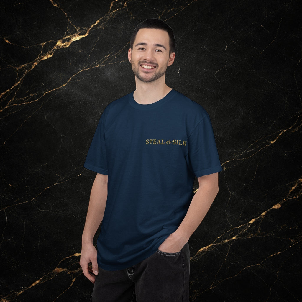 Steal & Silk navy blue cotton t-shirt with gold "Handle With Force" heart graphic on chest. Model wearing dark jeans.