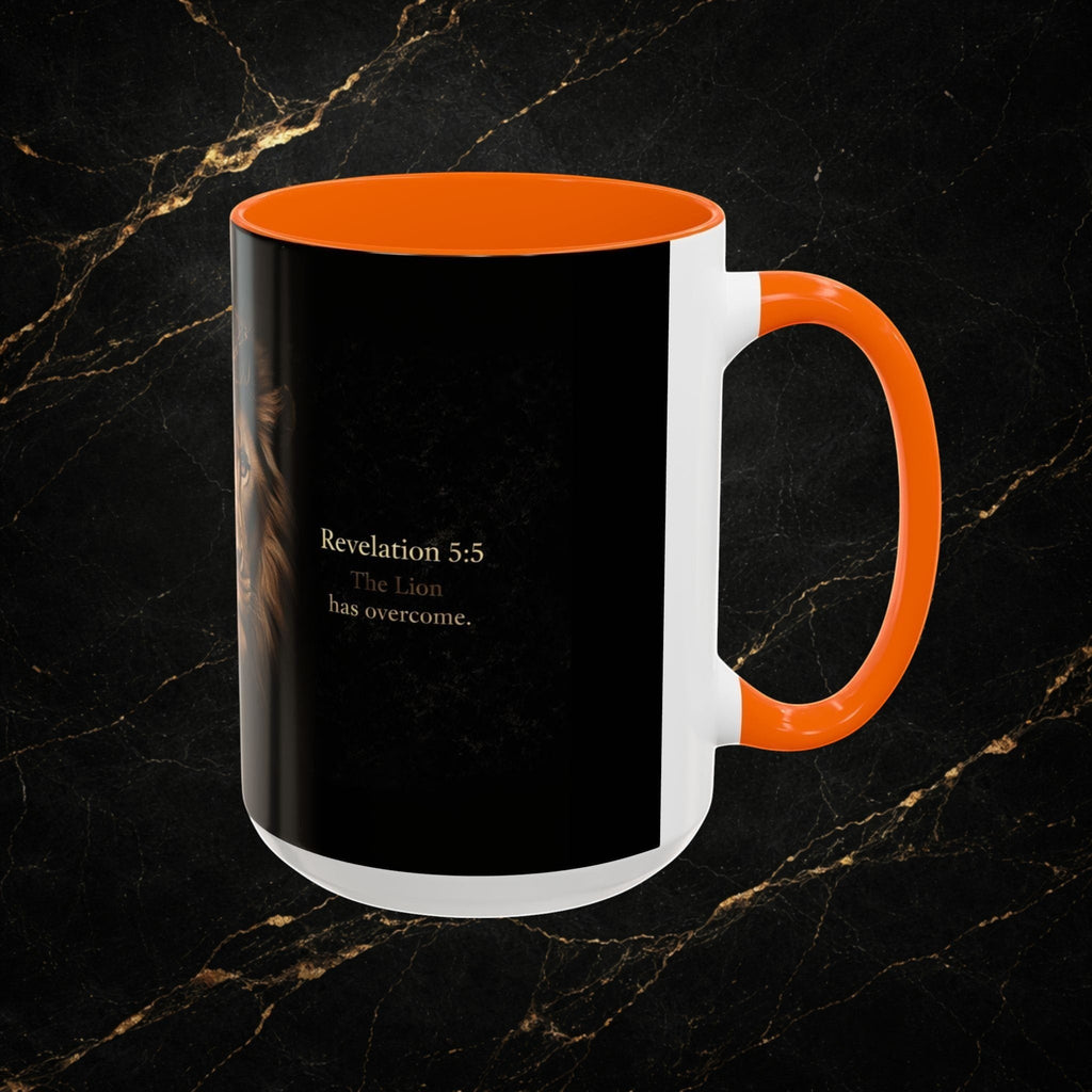 Steal & Silk white ceramic mug with orange handle and interior, featuring a black design with a lion's face and "Revelation 5:5 The Lion has overcome."