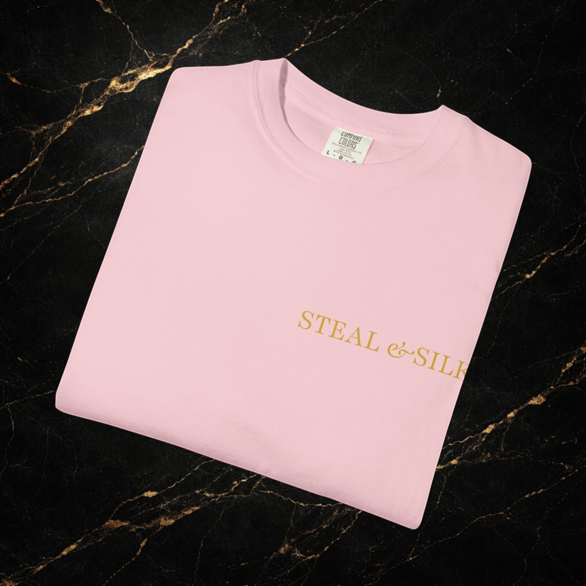 Steal & Silk light pink cotton t-shirt with gold "Handle With Force" heart graphic on front.