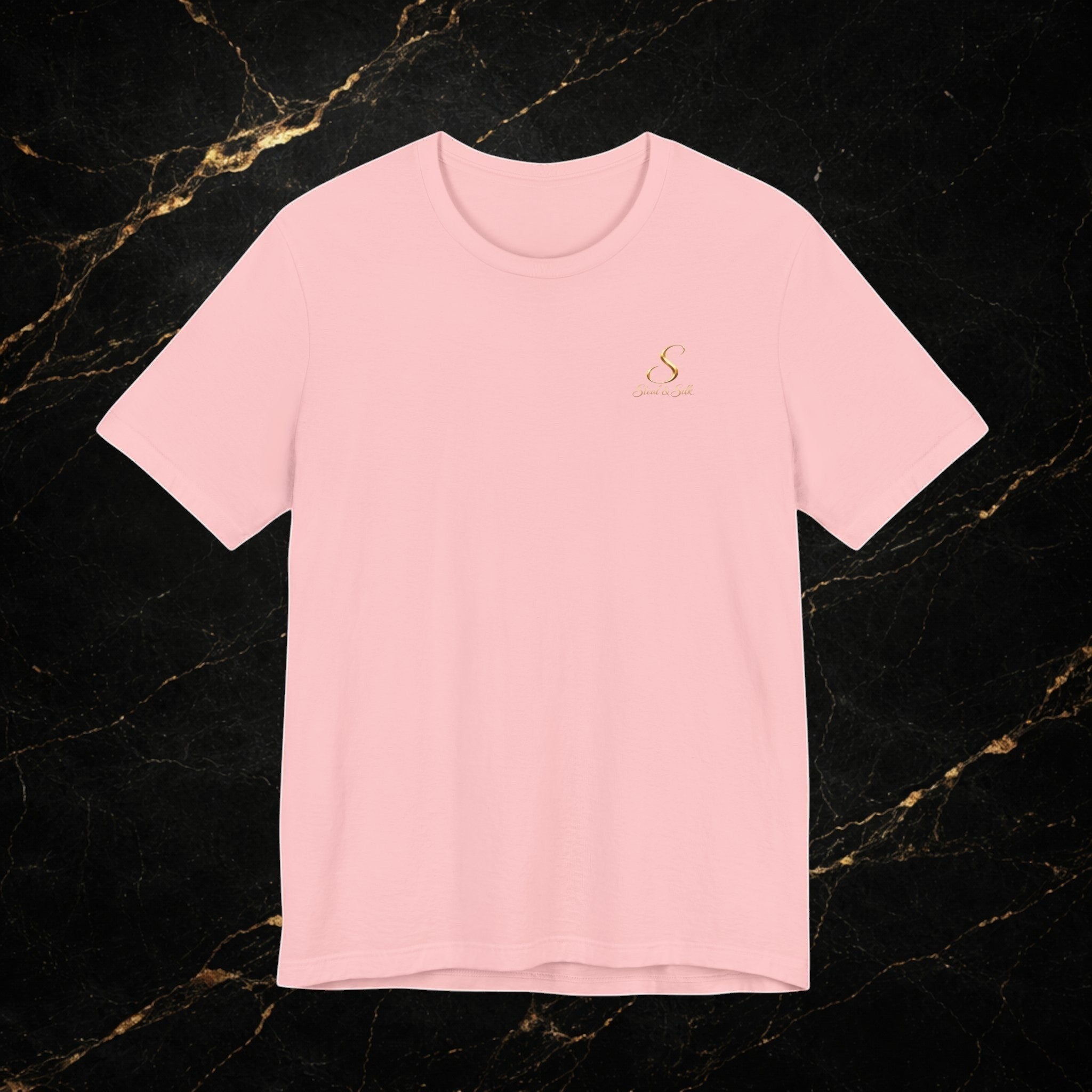 Steal & Silk light pink cotton t-shirt with a small gold "S" logo on the chest.