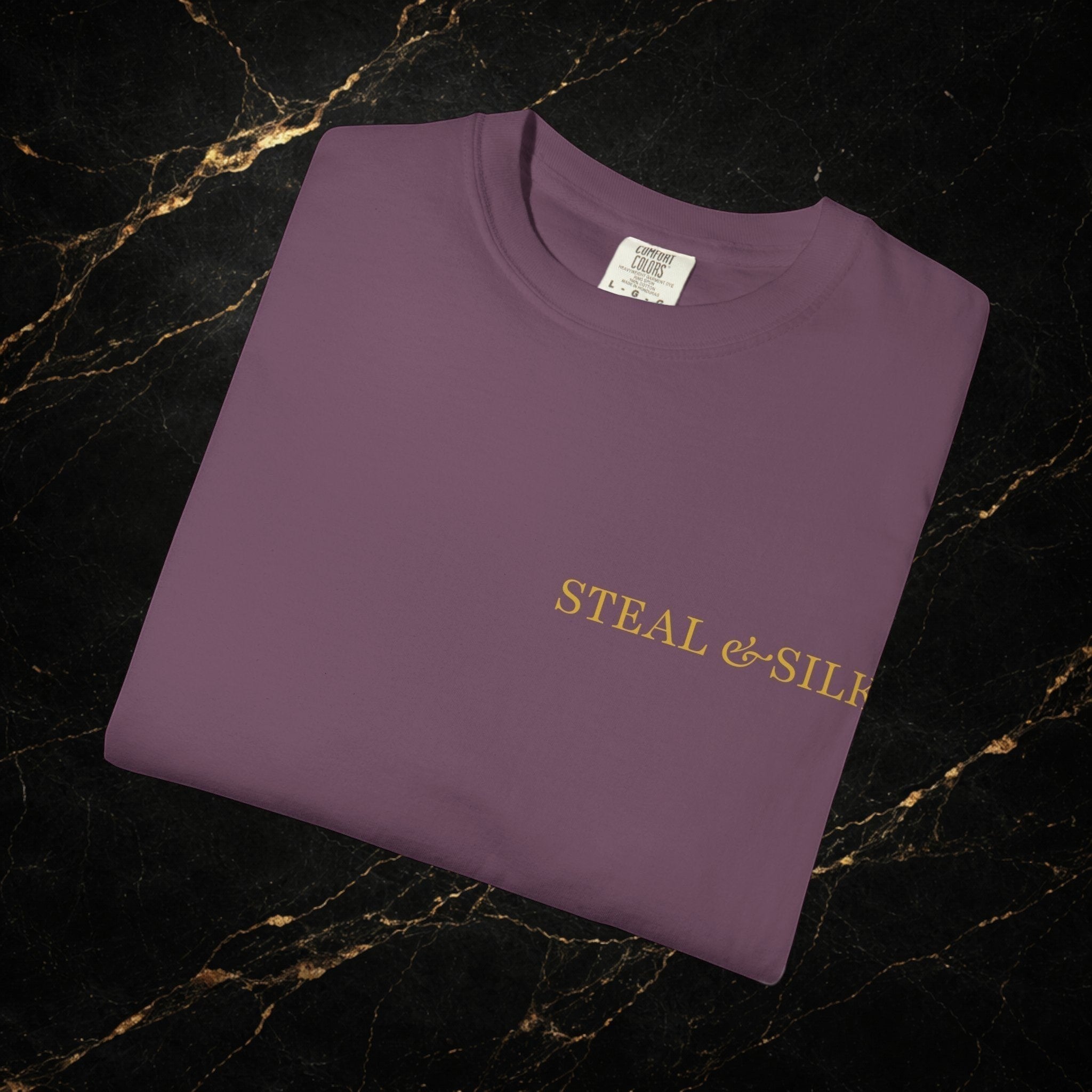 Steal & Silk purple cotton t-shirt with gold "Handle With Force" heart graphic on chest.