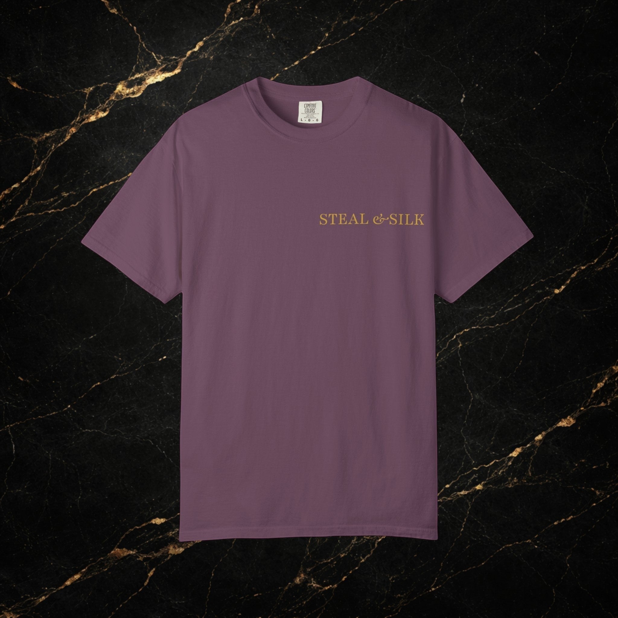 Steal & Silk plum purple cotton t-shirt with gold "Handle With Force" heart graphic on chest.