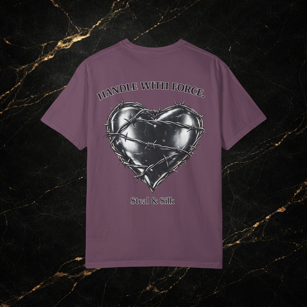 Steal & Silk purple cotton t-shirt with a metallic heart graphic wrapped in barbed wire and "Handle With Force" text.