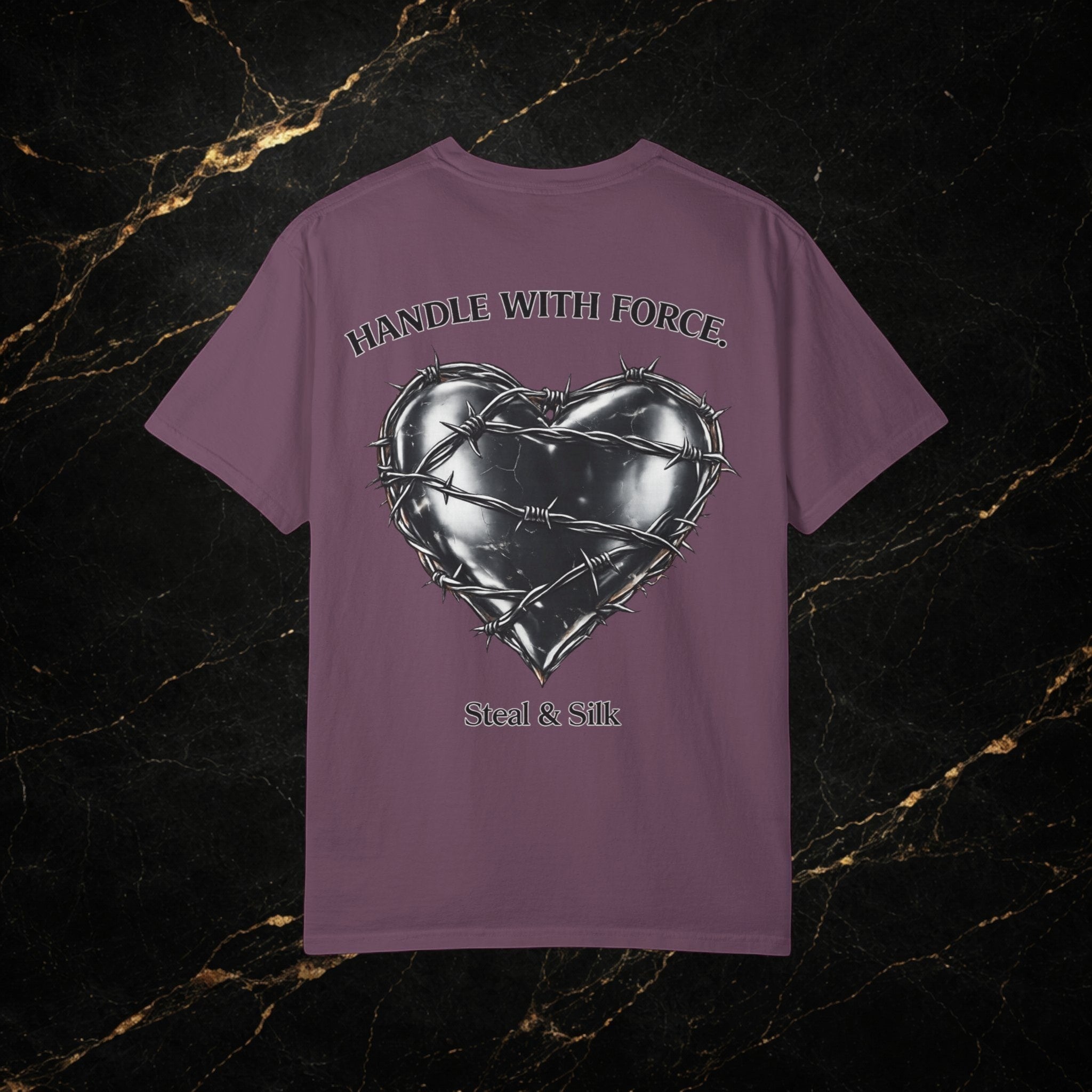 Steal & Silk purple cotton t-shirt with a metallic heart graphic wrapped in barbed wire and "Handle With Force" text.