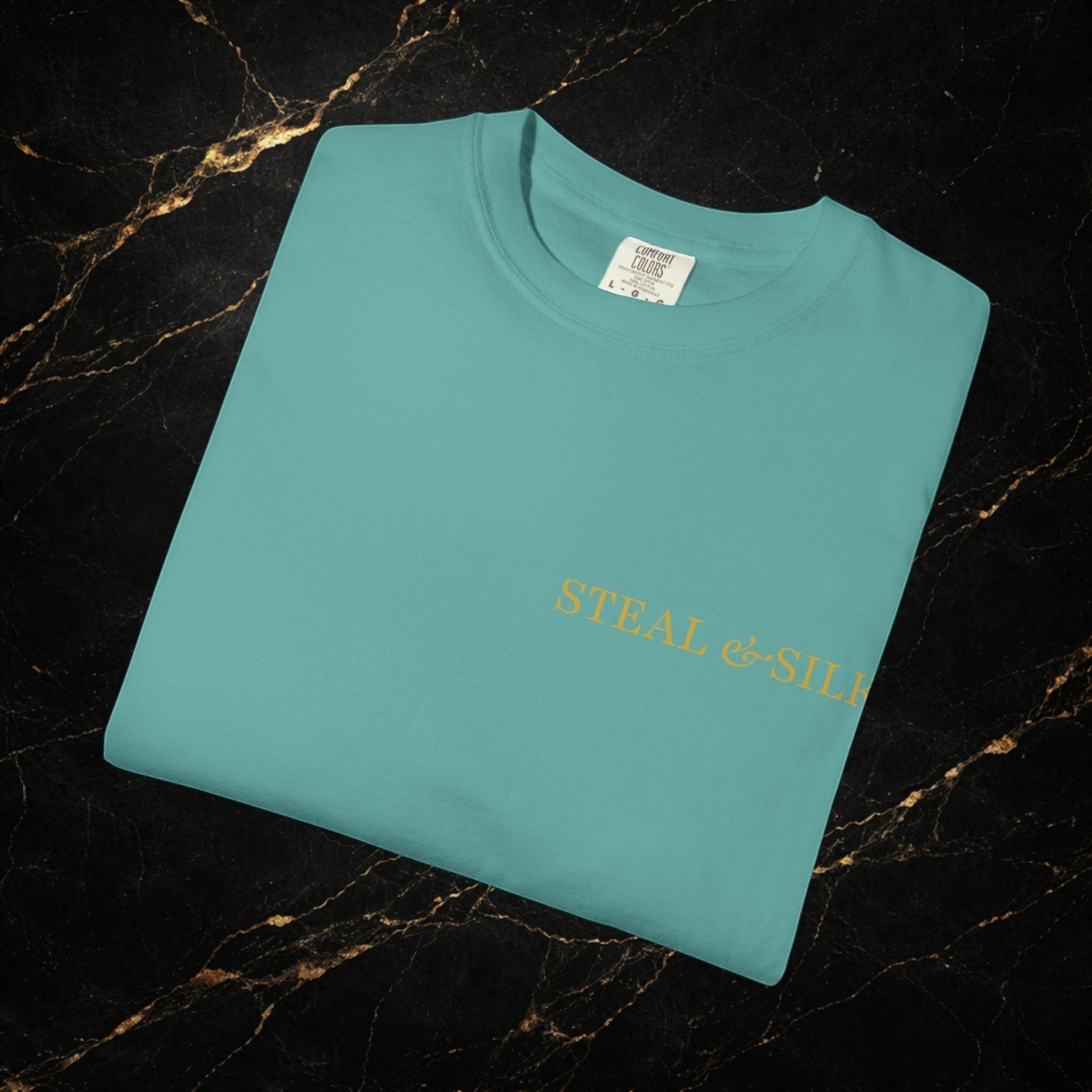 Steal & Silk teal cotton t-shirt with "Handle With Force" heart graphic on front. Modern fit.