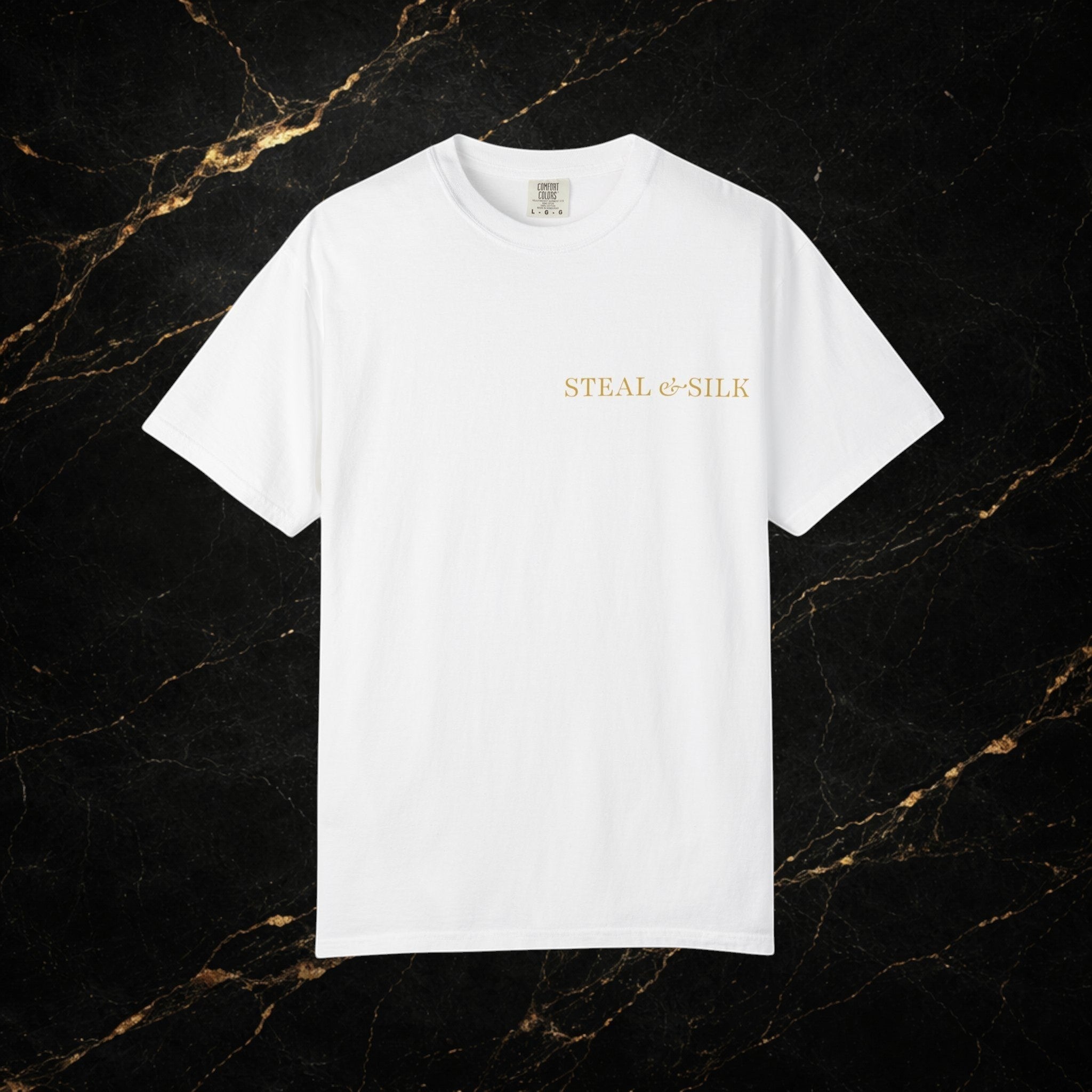 Steal & Silk white cotton t-shirt with gold "Handle With Force" heart graphic on the chest.