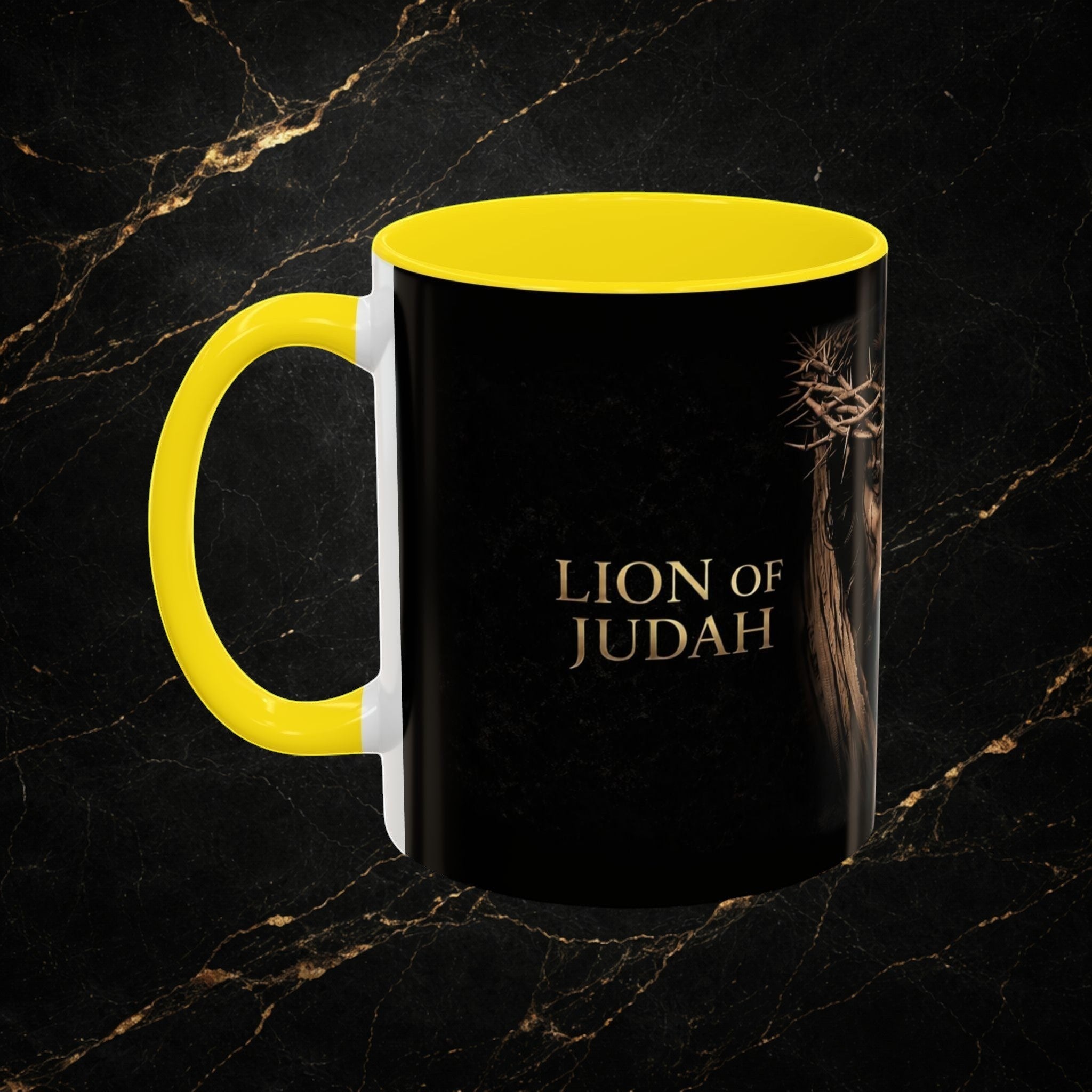 Steel & Silk black ceramic mug with yellow handle and interior, featuring the "Lion of Judah" text and a crown of thorns graphic.