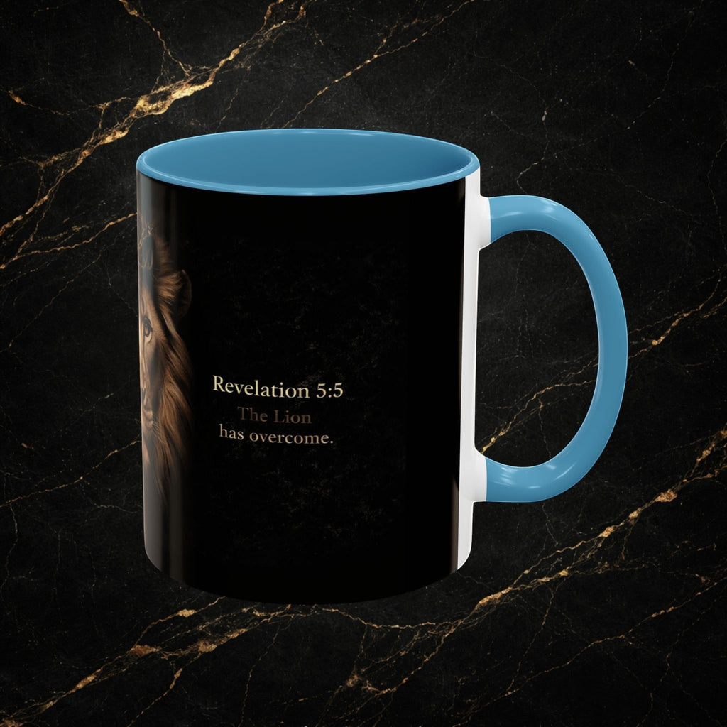 Steel & Silk Lion of Judah mug with Revelation 5:5 text. Ceramic mug with blue handle and interior.