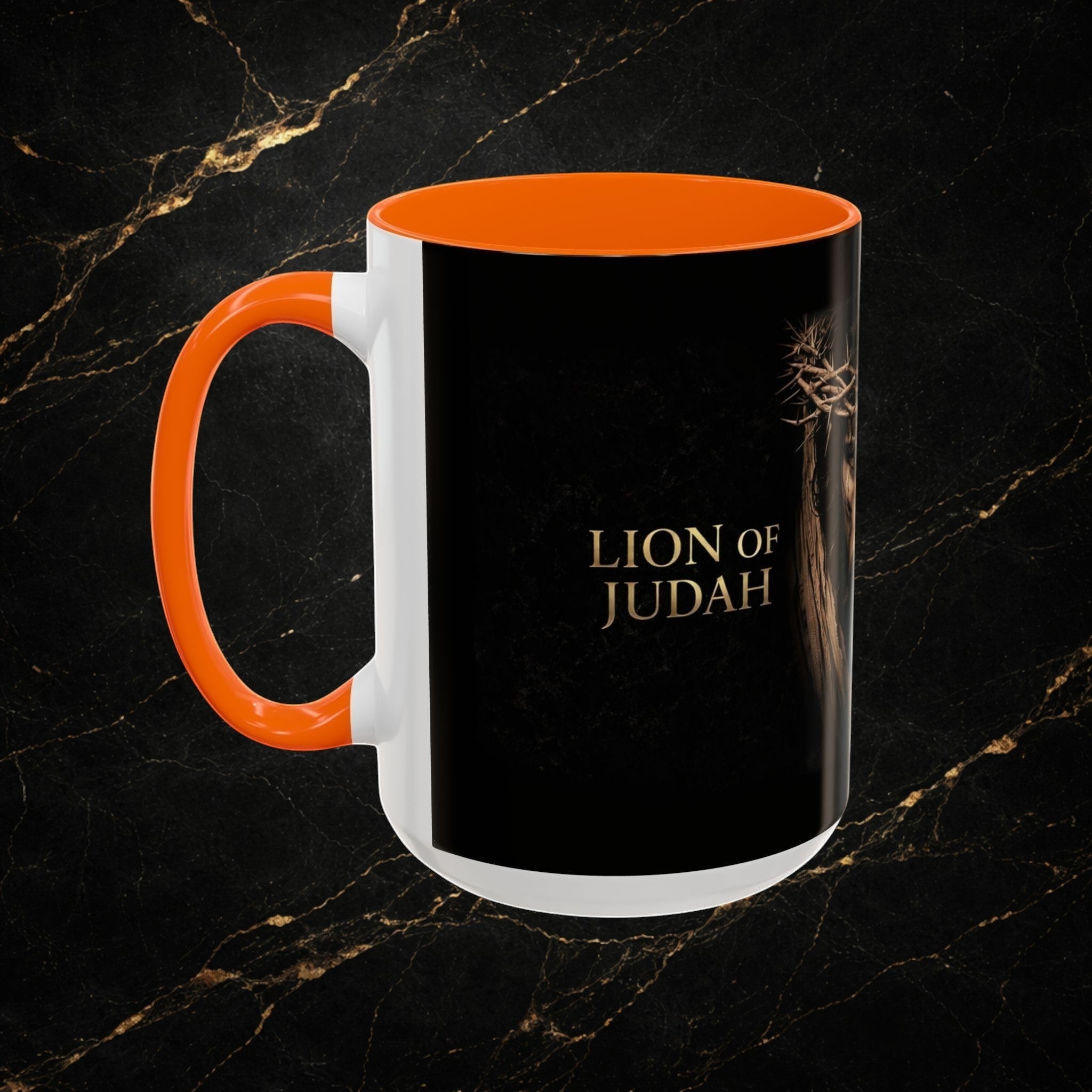 Steel & Silk white ceramic mug with orange handle and interior, featuring a black exterior with gold text "Lion of Judah" and an image of Jesus wearing a crown of thorns.