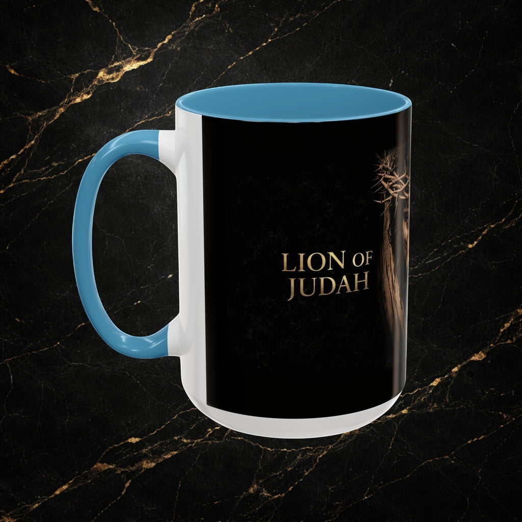 Steel & Silk Lion of Judah Overcomer ceramic mug with blue handle and interior, featuring a crown of thorns and gold text.