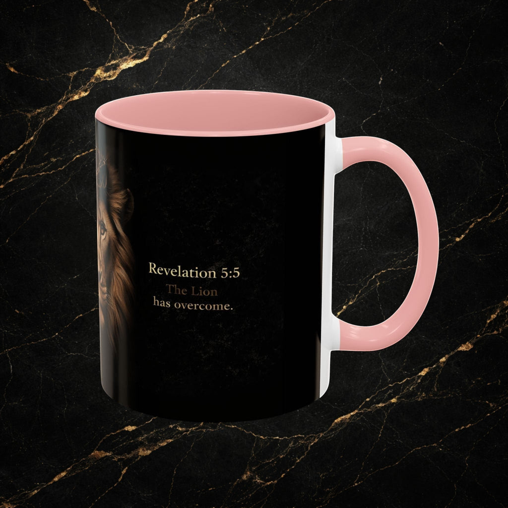 Steel & Silk black ceramic mug with pink handle, featuring a Lion of Judah graphic and "Revelation 5:5 The Lion has overcome."