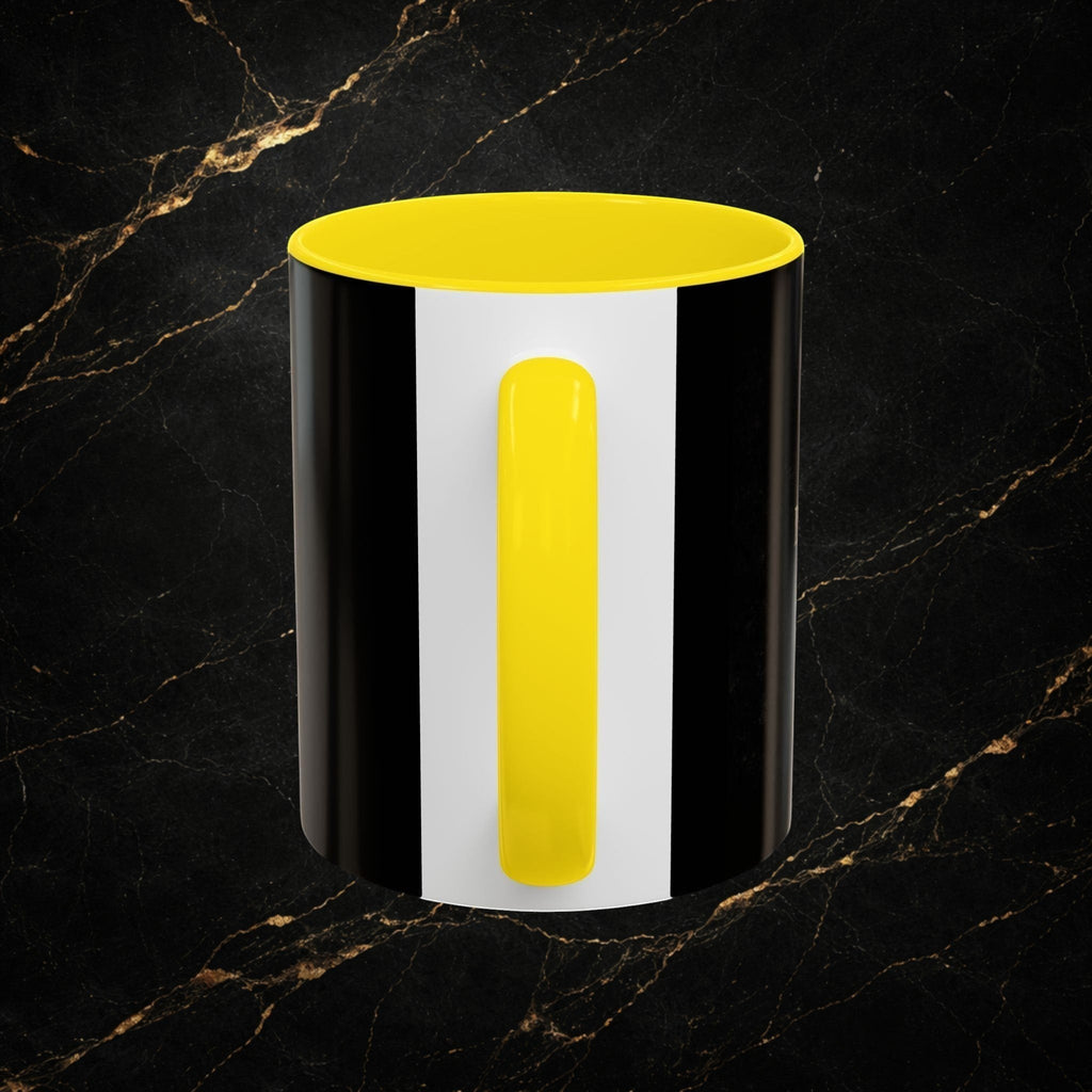 Steel & Silk black and white striped ceramic mug with yellow handle and interior. "The Overcomer" design.